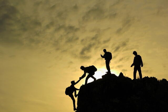 challenging_challenge_climb_cliff_group_help_together-1.jpg