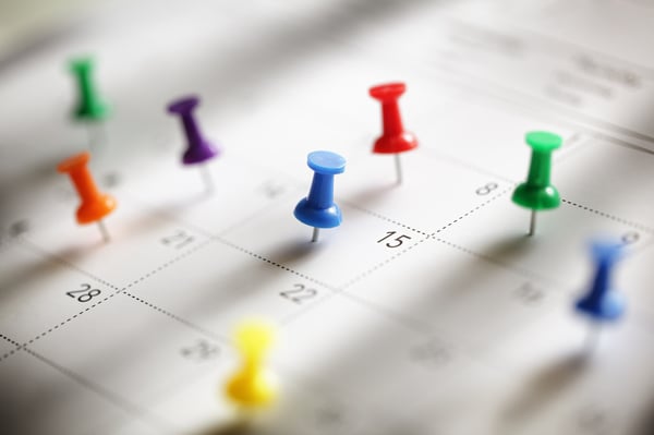 Pins indicating appointments on calendar